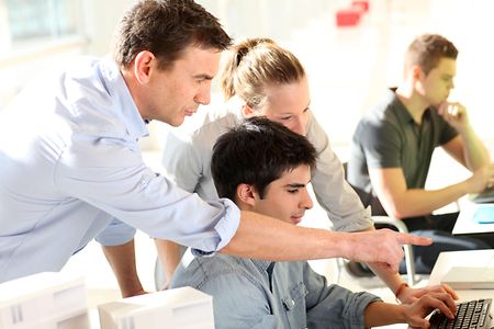 Teacher with students in training class