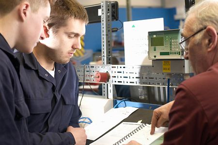 Electrical engineers working in shop