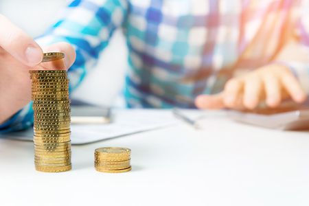 Concept of enrichment and financial growth. Gold coins.