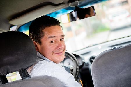 Taxi driver in the car