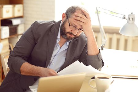 Mature Adult man working in the office