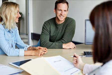Couple having discussion with doctor over document