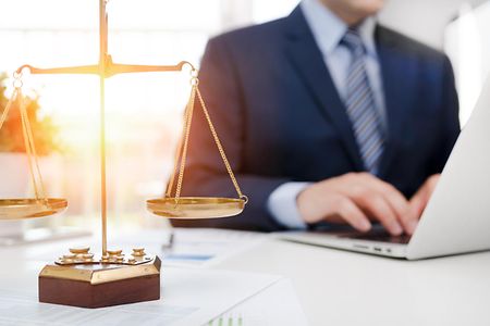 Justice symbol weight scales on table