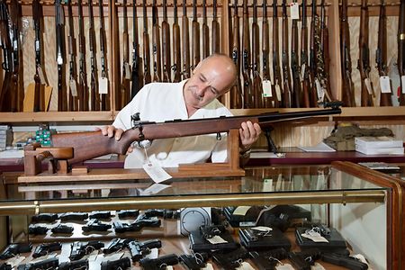 Happy Gun Store Owner