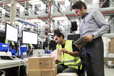Warehouse workers preparing goods for dispatch