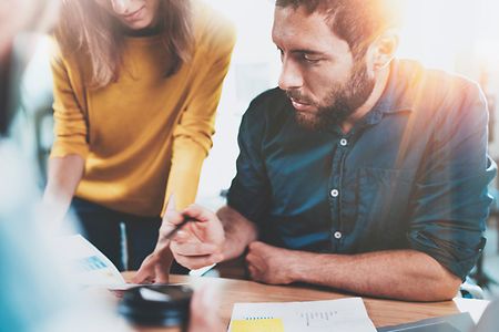 Teamwork concept.Business team sitting at meeting room and making conversations at office.Horizontal.Blurred background.Flare.