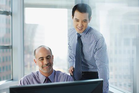 Businessmen working together in office