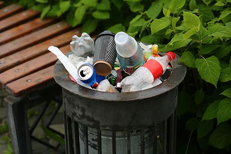 Trash bin full of garbage