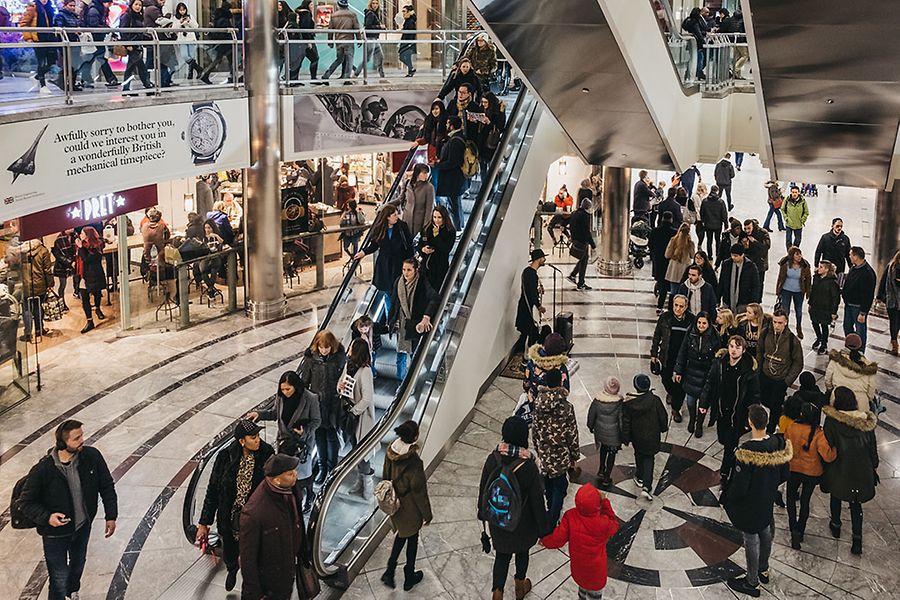 People inside One Canada Square Mall in Canary Wharf, London, UK.