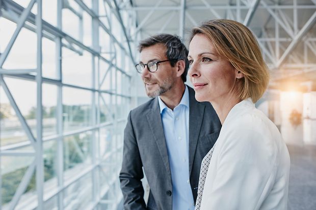 Businesswoman and businessman at the airport