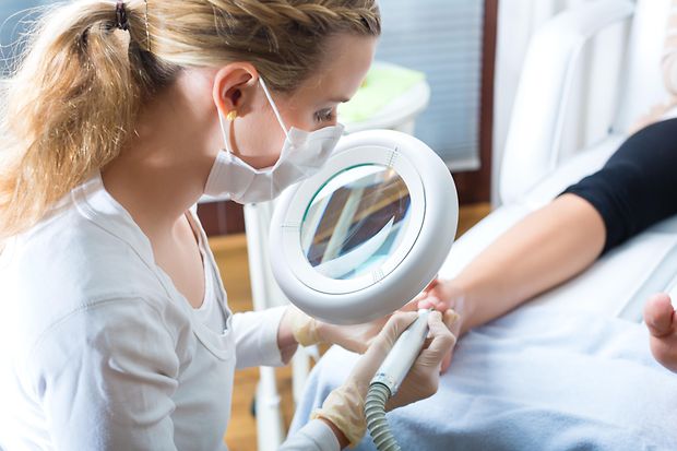 Woman receiving podiatry treatment in Day Spa